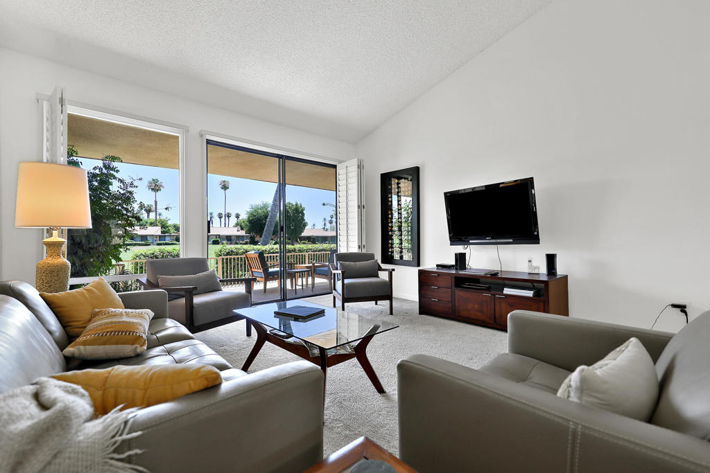 This Granada floor plan at Sunrise Country Club offers a resort-like atmosphere with two bedrooms, two bathrooms, and a spacious open living area. The private courtyard entry provides ample space for outdoor living and dining. Both the living room and primary bedroom feature sliding glass doors that lead to the back patio, while the second bedroom is situated separately to ensure guest privacy, offering direct access to the private front courtyard.Sunrise Country Club is a guard-gated community comprising 746 residential condominiums, an 18-hole par 64 golf course, nine championship tennis courts, ten pickleball courts, twenty-one swimming pools and spas, a clubhouse with dining room, lounge, grille, golf and tennis pro shops, as well as a fitness and activity center. There are also two new bocce ball courts. Located in Rancho Mirage, in the heart of the desert, the community is conveniently close to major shopping centers, entertainment venues, healthcare facilities, and just 20 minutes from Palm Springs International Airport.