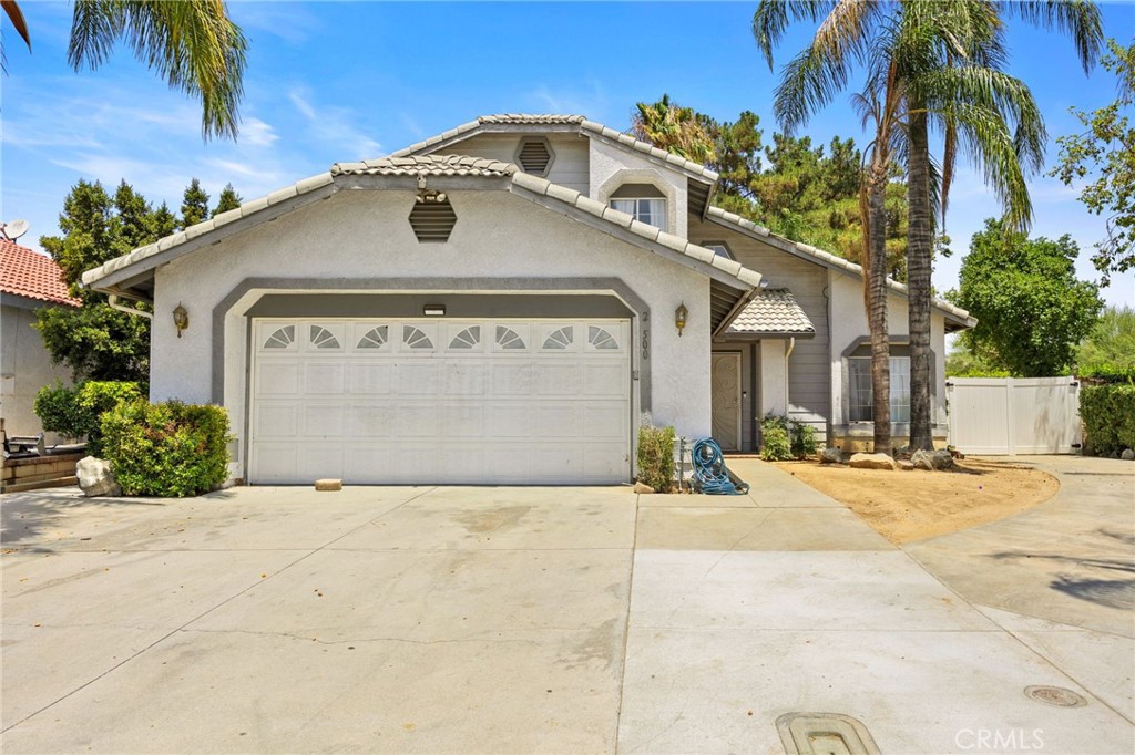 Charming Family Home on a Corner Lot
Welcome to 26500 Coconut Lanea s pacious and inviting two-story residence in the heart of Moreno Valley. With nearly 1,916 sq ft, this home features four bedrooms and 2.5 baths, including a convenient ground-floor bedroom suite perfect for guests or multi-generational living. Gather around the cozy fireplace in the family room, or entertain in the separate living and dining spaces all with a view of your yard’s mature palms. A covered patio enhances your outdoor lifestyle, while a corner-lot setting ensures both privacy and curb appeal.