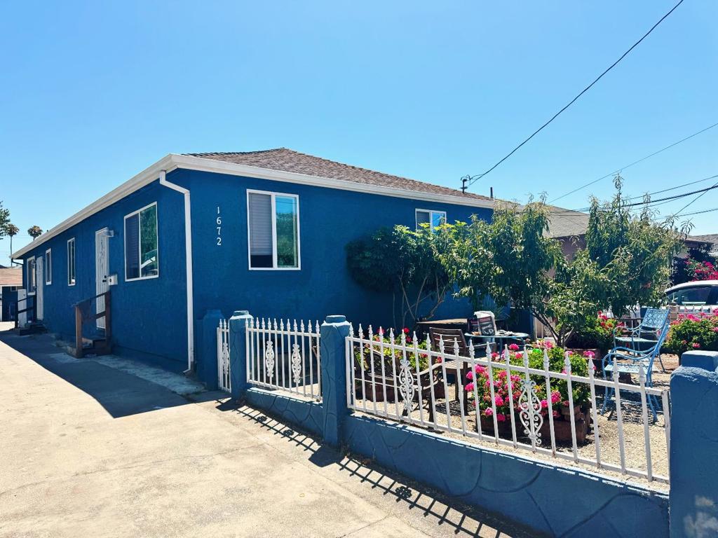 Great income-producing duplex with additional converted trailer on a large lot. The front unit is a 2-bedroom, 1-bath with updated kitchen, wood floors, and spacious layout, currently rented for $2,800/month. The back unit is a 1-bedroom, 1-bath with modern updates, rented for $2,150/month. The converted trailer in the rear is rented at $1,300/month. Total rental income of $6,250/month. Large storage structure on site and ample outdoor space. Ideal for investors or owner-occupants looking to offset mortgage costs. Significant upside potential on a flexible-use, casual property.
