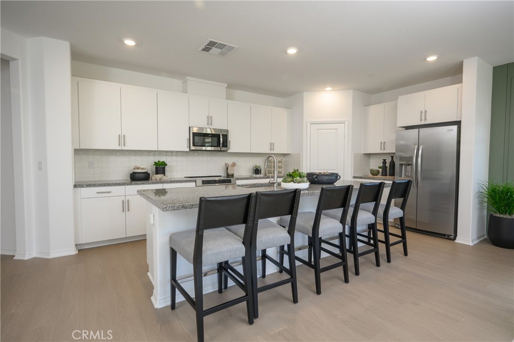 NEW CONSTRUCTION! This new single-level home boasts a spacious and low-maintenance layout designed for modern lifestyles. Three secondary bedrooms are located off the entry, leading to an open-concept floorplan shared between the kitchen, living and dining areas. Nestled into a private rear corner is the lavish owner’s suite, offering direct access to a spa-inspired bathroom and generous walk-in closet.
Silverstone is a brand-new collection bringing new single-family homes to the Green Valley Ranch masterplan, now selling in Perris, CA. Residents will enjoy access to fantastic onsite amenities and spacious, two-story home designs. Local attractions including Lake Perris, the Railway Museum and the Perris Speedway offer ample recreation and entertainment options. Proximity to the 215 and 74 freeways helps to simplify everyday commutes and travel, and the community is serviced by schools in the Romoland and Perris Unified School Districts.