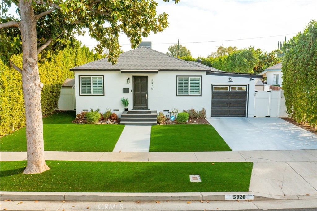 Step into this absolutely beautiful, fully remodeled home that perfectly blends comfort and style. Featuring 4 bedrooms and 3 bathrooms, this home has been thoughtfully updated with designer touches throughout. Enjoy stunning waterproof hardwood floors and an all-new kitchen with quartz countertops and premium finishes. The bathrooms have been meticulously redesigned with high-end features, and the private primary suite boasts a luxurious en-suite bathroom. Modern upgrades include new air conditioning and stylish indoor doors, ensuring a move-in-ready experience. The beautifully landscaped private yard is an entertainer's dream, complete with a built-in fireplace, a barbecue area, and ample seating, making it perfect for hosting family and friends. Don’t miss the chance to call this charming, updated property your dream home!