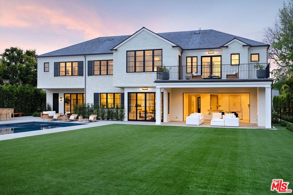 "Style and Substance" Brand new 2024 construction white brick Traditional designed by Ken Ungar. The perfect floor plan in the perfect Beverly Hills location. Soaring 11ft ceiling heights throughout main floor, two-story entry foyer, gracious formal living/dining rooms for entertaining. Gourmet show kitchen and incredible open concept living area flow seamlessly to manicured gardens. Wood paneled office. Primary suite features: sitting room, patio, dual baths in book-matched slab marble and large closets. 8 additional bedrooms all ensuite. Additional features include: screening room, gym/wellness area, lower level game room with bar, wine cellar for over 1,800+ bottles, chef's kitchen, 4-car garage, separate guest house, elevator, European white oak floors throughout and home automation. Pool area with outdoor kitchen and fire pit. A rare opportunity to own a brand-new classic!