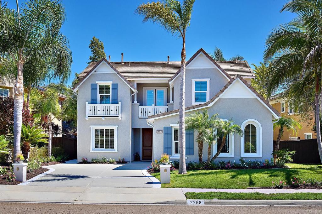 Tucked on a quiet cul-de-sac in one of Carlsbad’s most sought-after communities, this spacious 5-bedroom, 5.5-bath residence offers 3,642 sq. ft. of refined living. Built in 2006 and freshly painted inside and out, the home balances timeless style with modern comfort. Step inside to find a thoughtfully designed first floor featuring an inviting eat-in kitchen with granite counters, built-in stainless steel appliances, and generous cabinetry. A formal dining room, comfortable family room, office, and versatile flex space—perfect as a second office, homeschool room, or playroom—offer flexibility to fit any lifestyle. The convenient first-floor guest suite provides privacy for overnight visitors. Upstairs, four generously sized bedrooms, each with its own full bath, are complemented by a loft-style bonus room and French doors that open to a sunny balcony. The luxurious primary suite is a true retreat, complete with a private balcony, oversized jetted tub, dual shower heads, and a walk-in closet. As part of the La Costa Greens community, residents enjoy world-class amenities: a resort-style pool and spa with cabanas, a private gym, tennis courts, playgrounds, a rose garden, a tranquil pond, and a clubhouse with a full kitchen and entertainment patio. This home is more than a residence—it’s an opportunity to enjoy Carlsbad’s premier lifestyle in a highly desirable neighborhood.