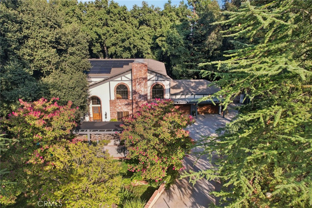 Welcome to your own private sanctuary in the heart of Oak Glen, where nature, comfort, and community come together seamlessly. Tucked away on a sprawling park-like lot with mature oaks, towering evergreens, and a year-round running stream, this home offers a lifestyle that feels more like a retreat than a residence. From the moment you step onto the property, you will be captivated by the lush greenery, serene pathways, and peaceful sounds of water flowing through your backyard, perfect for evenings under the stars, weekend mornings with coffee on the deck, and children playing freely surrounded by the beauty of nature. Inside, the home blends warmth and functionality with open living spaces, a chef’s kitchen designed for gatherings, and large windows framing the incredible scenery at every turn. Whether you are hosting friends in the outdoor kitchen, enjoying a cozy night by the fireplace, or simply relaxing on the covered patio, this home offers the perfect balance of elegance and ease. The Oak Glen community is renowned for its charming apple orchards, mountain air, and friendly small town spirit, while families will appreciate access to the highly regarded Yucaipa Calimesa schools offering top tier education close to home. This is not just a property, it is a lifestyle and a rare opportunity to own a slice of Oak Glen’s natural beauty while staying connected to everything that makes this community so special.