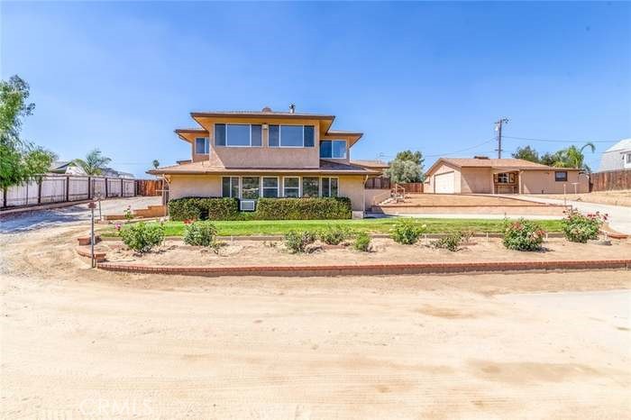 Stop and check out this custom home with attached apartment-ADU on almost an acre lot with beautiful views of the hills and Ramona Bowl. This home will boast 2,398sqft, 3 bedroom (with possible 4th) and 3bathrooms. Kitchen has breakfast nook and eat-in counter with plenty of cabinet space. Family, dining and spacious bonus room that can be used as a bedroom. Will feature a totally separate 1bed/1bath apartment with kitchen, living area and 2 car garage. In addition to all this, there is plenty of driveway for RV parking, a detached 2 car garage with custom workshop, 1 car carport, covered storage areas, a separate gated area for animals with storage shed and additional storage structures. The entire property is gated and the entry has am automatic gate. You will enjoy fabulous views of the hills and Ramona Bowl from your covered front porch and conveniently located near shopping, dining, and the Domenigoni Pkwy. Don't this spectacular home pass up with so many other features to appreciate.