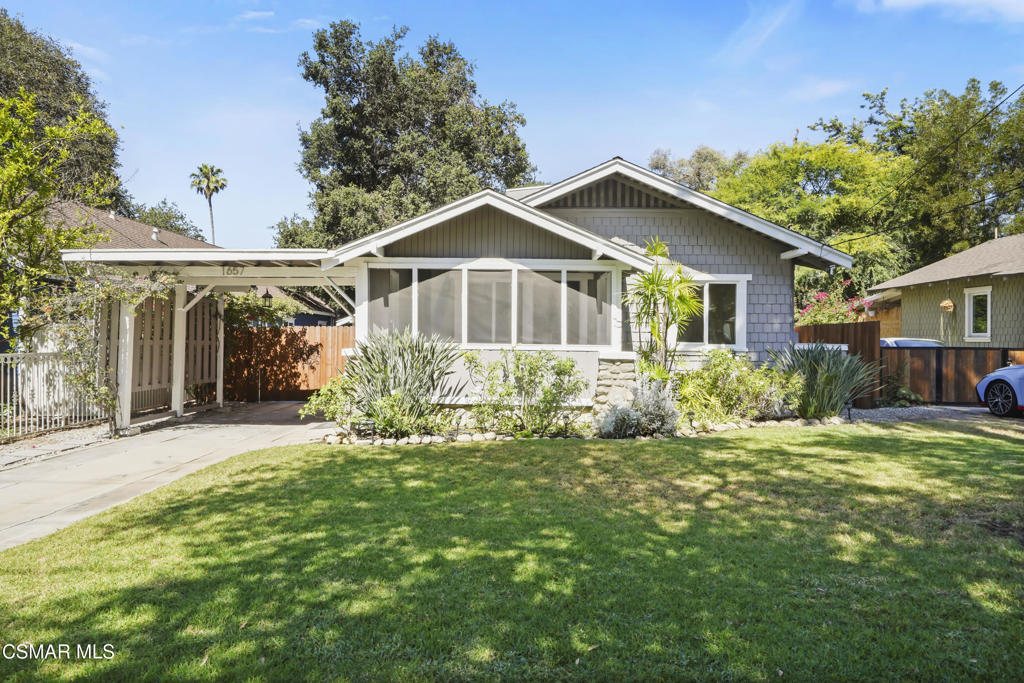 Step into this beautifully maintained 1916 Pasadena craftsman character home, where original charm blends seamlessly with thoughtful modern updates. From the moment you arrive, the inviting screened-in front porch sets the tone for this warm and welcoming property.Inside, you'll find a spacious living area anchored by a stunning original stone fireplace and a formal dining room featuring built-in cabinets that speak to the home's historic roots. The entire interior has been freshly painted and features brand-new laminate hardwood flooring throughout.Enjoy year-round comfort with central heat and air, along with dual-pane windows (installed in 2010) and a new roof added in 2018. The kitchen is equipped with stainless steel appliances and a gas stove, and the dedicated laundry room offers washer and dryer hookups.Outdoors, the fully fenced backyard (fence built in 2020) includes a mature avocado and grapefruit tree, a lush lawn with in-ground automated sprinklers, and west-facing views of the Arroyo and Rose Bowl -- perfect for enjoying sunset evenings. Gated driveway parking with a solar-powered electric gate provides added privacy and convenience.Close to the Rose Bowl and Old Town Pasadena, with easy access to downtown Los Angeles -- this home is a rare blend of vintage detail and modern ease in an unbeatable location.