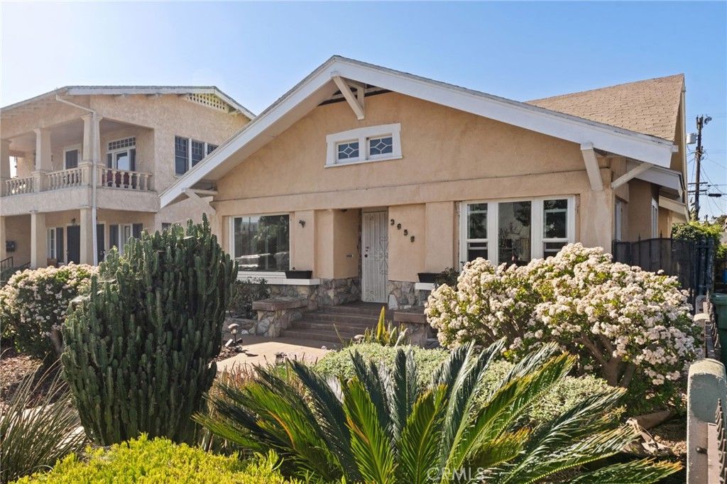 Photo of 3959 Denker Avenue, Los Angeles, CA 90062 (MLS # OC26022553)