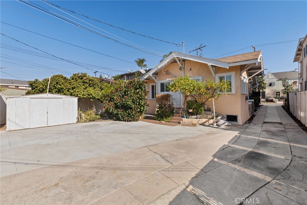 Photo of 3959 Denker Avenue, Los Angeles, CA 90062 (MLS # OC26022553)