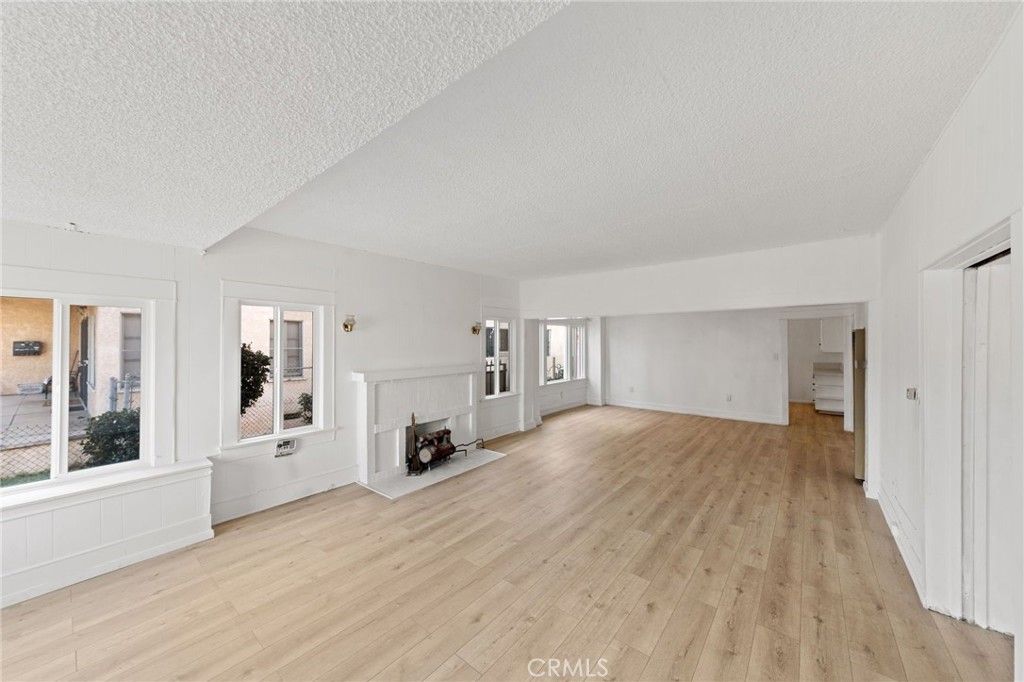 Photo of 3959 Denker Avenue, Los Angeles, CA 90062 (MLS # OC26022553)