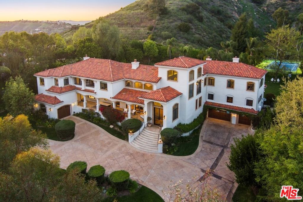 One-of-a-kind Trophy Property, located in the Most Prestigious Gated Development known as "Park South Estates" with a Prime Calabasas location. This incredible Contemporary Mediterranean Estate is nestled at the end of a private cul-de-sac and features 6 beds, 9 baths with approx 8,152 sq ft sited on approx 8+ private manicured acres. This beautifully designed estate has everything that anyone could ever ask for. It feels like you are living in your own private resort. This estate has the utmost impeccable attention to detail with quality and craftsmanship second to none. The home features a Grand Formal entry w/ soaring ceilings which leads you to a light filled 2-story living room with a custom 30-foot matched marble fireplace, custom lighting and a beautiful formal dining room. White Oak hardwood floors throughout all living areas, custom designed window coverings, Chef's kitchen w/ massive island, quartz countertops, stainless Sub Zero Refrigerator & Freezer, Wolf 6 burner range, Wolf Stainless Double Ovens, Dual SS Dishwasher, Micro and more. Wonderful breakfast bar, walk-in pantry adj to the kitchen, and living room w/ stone fireplace and large built-in custom cabinetry. Secondary formal living room, billiards room with full wet bar & 21 seat commercial style theater adorn the other side of the first floor. There are several large entertaining pavilions to enjoy the tranquility and greenbelt views. The lush private back yard which is truly an oasis has built-in BBQ, covered outdoor dining patio & Cabana with TV & Fireplace, beach entry lagoon style pool/spa w/ waterfall, huge lawn & professional lighted N/S tennis court and sports court. This amazing yard also boasts your own private garden, citrus / fruit / avocado trees and storage sheds. Upstairs features a private master suite w/ fireplace, three walk in closets, mountain and valley views, luxurious bath w/ soaking tub & gym/office. There are 4 additional bedroom suites upstairs w/ two massive balconies + office/conference area in the center of the home. There is an addtl bedroom suite off kitchen, two garages (4 cars) all with custom built high end storage cabinets and acrylic floors perfect to store your super cars or classics & space for 10+ cars in the rounded entryway. This property also has a temperature controlled wine cellar and a features a rarely found safe room / artillery room. This smart home features an RTI system which controls A/V systems throughout the home, HVAC, lights and cameras. The home is being offered fully furnished including all A/V systems and theatre equipment. If you are looking for an amazing property, this is a very rare find that has been meticulously cared for.