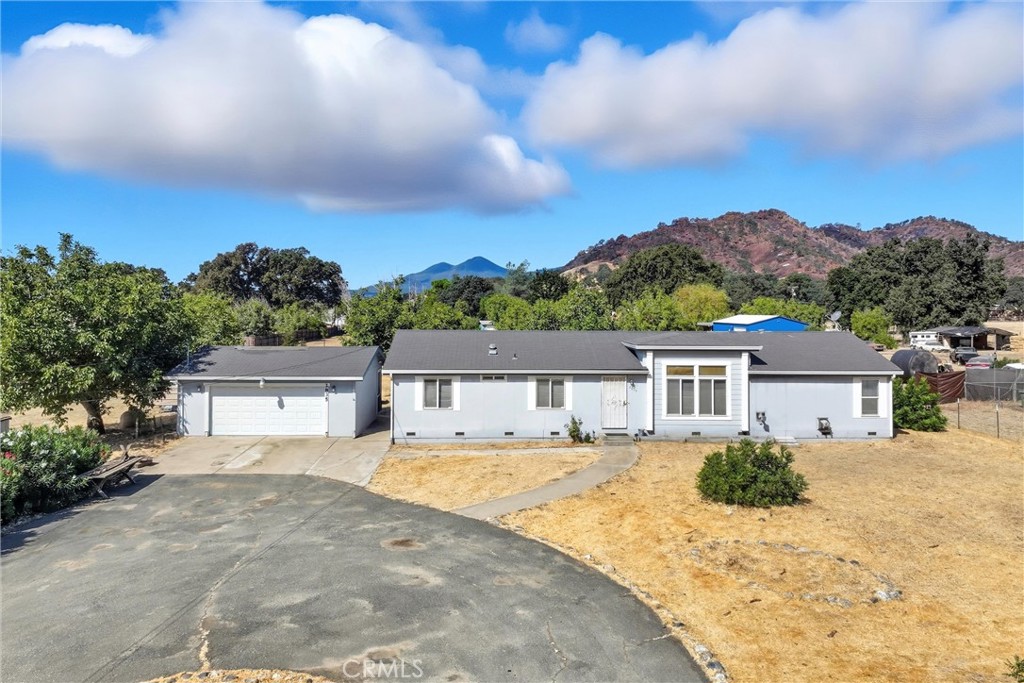 Spacious 4-bedroom, 2-bath manufactured home on 1.25 level acres in the desirable Burns Valley area of Clearlake. With 1,694 sq. ft. of living space, this property offers plenty of room to spread out and enjoy country-style living close to town. A built-in pool with a fenced area around pool and patio creates the perfect setting for summer gatherings, while the RV carport and two additional sheds provide abundant storage. Inside, stay comfortable year-round with central heat and air, pellet stove, and Monitor-style heater. The private well supplies water for household or hobby uses, making this an ideal setup for a mini-farm, horses, or gardening. A rare combination of space, amenities, and convenience, this property is ready for your new life—whether for family living, entertaining, or hobby farming.