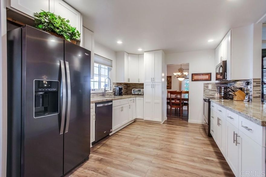 Beautifully updated home in highly desired Palomar Estates West.  The open floor plan and vaulted ceiling in the living room make this home feel very spacious.  The stunning kitchen has been remodeled with white shaker cabinets and natural stone countertops.  The primary bedroom has an on-suite bathroom with a gorgeous tiled shower.  The second bedroom has a large sitting area that can be used as an office.  The home has dual pane vinyl windows throughout that will keep the home very comfortable in the wonderful San Marcos weather.  Plank vinyl flooring is located throughout the main living areas.  From the back porch you can enjoy beautiful sunrises and views of the surrounding hills.  There is a large shed to store your extra items and lots of guest parking right next to the house for your guests.  The home is on registration which means NO PROPERTY TAX.  Palomar Estates West is a 5 star 55+/35+ senior rent controlled park with many activities and amenities including a beautiful clubhouse, pool, spa, gym, putting green, pickleball courts, and tennis courts. This home is located minutes to Lake San Marcos dining and golf as well as local Carlsbad beaches, shopping, and restaurants.