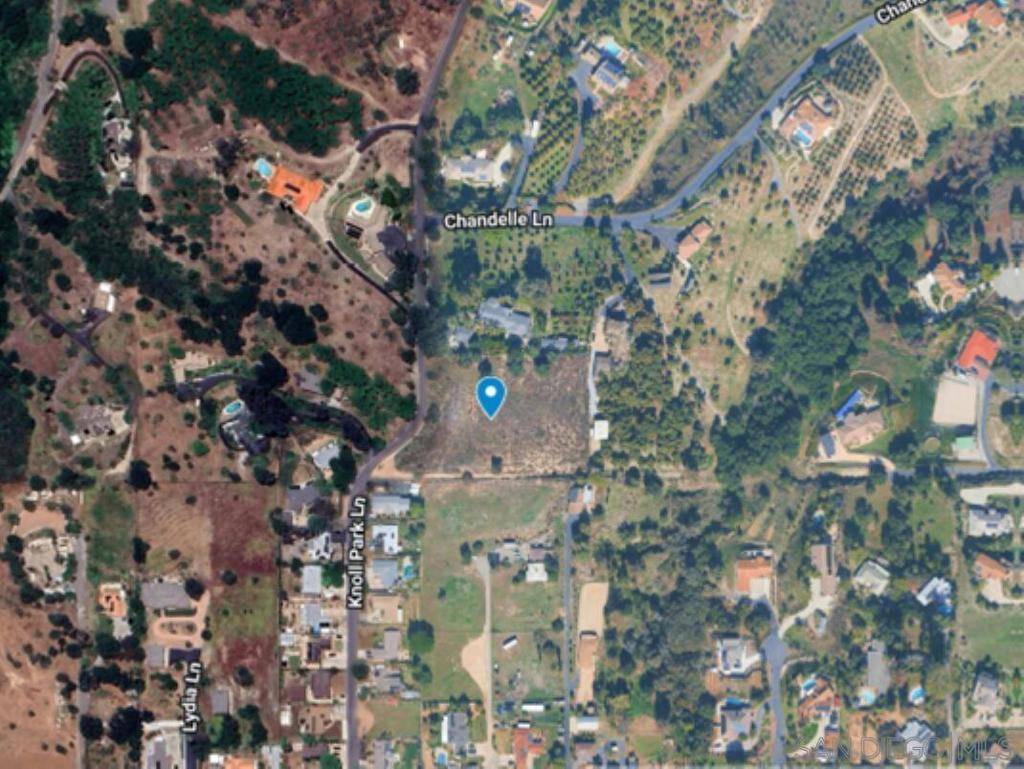 2.45 acre parcel on Knoll Park Lane in Fallbrook. This beautiful property has a 360-degree view and was owned by the Fallbrook Water District from 1959 until just last year, otherwise it would have been developed many years ago, due to its beautiful setting. The lot had a comprehensive perc test done last year and recently received septic approval for a 4-BR home, and an ADU could easily be included. The water district already has water onsite, making for an easy meter installation. There is also already an SDGE easement and power pole. The property is completely fenced on 3 boundaries, with vehicle access. It also has easements along the main road for impressive driveway options. There is a center knoll sloping slightly in every direction with large usable areas. There are a few olive trees scattered throughout. This is a truly special "King-of-the-Hill" type of property. Close to town and close to Interstate 15, in beautiful Fallbrook. A park-like setting with refreshing breezes and spectacular views!