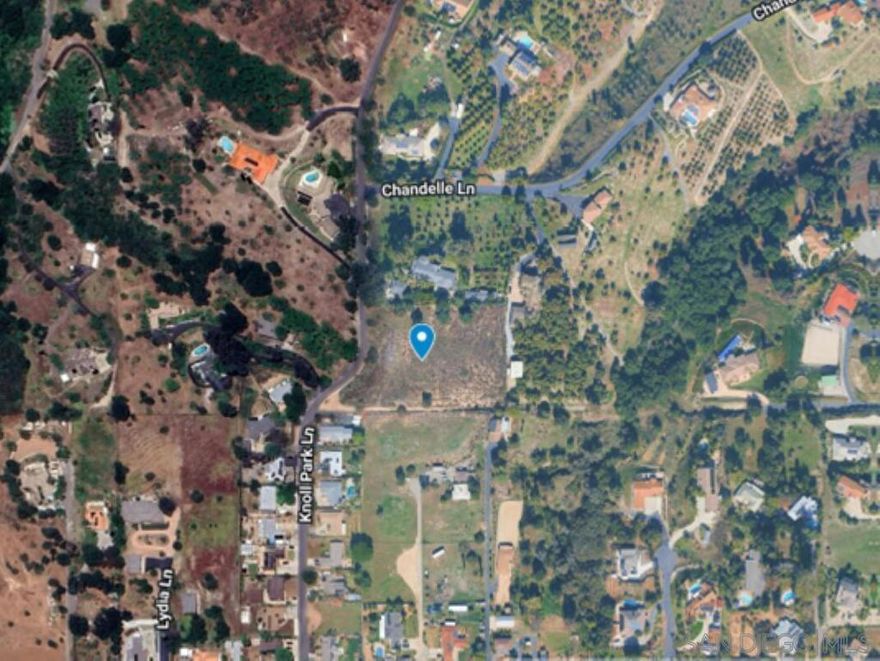 2.45 acre parcel on Knoll Park Lane in Fallbrook. This beautiful property has a 360-degree view and was owned by the Fallbrook Water District from 1959 until just last year, otherwise it would have been developed many years ago, due to its beautiful setting. The lot had a comprehensive perc test done last year and recently received septic approval for a 4-BR home, and an ADU could easily be included. The water district already has water onsite, making for an easy meter installation. There is also already an SDGE easement and power pole. The property is completely fenced on 3 boundaries, with vehicle access. It also has easements along the main road for impressive driveway options. There is a center knoll sloping slightly in every direction with large usable areas. There are a few olive trees scattered throughout. This is a truly special "King-of-the-Hill" type of property. Close to town and close to Interstate 15, in beautiful Fallbrook. A park-like setting with refreshing breezes and spectacular views!