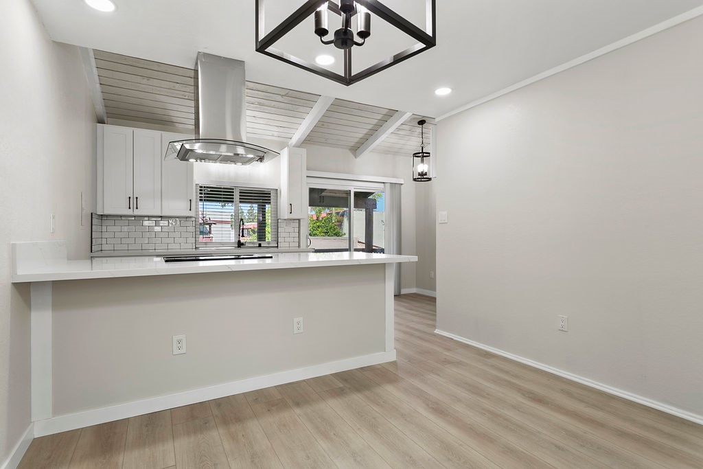 Nestled in highly sought-after MacArthur Village with resort style amenities as your backdrop, this exquisitely remodeled condo is a residence that promises not just a home, but a lifestyle adorned with beauty and tranquility. At the heart of this captivating home is a dramatic island kitchen, a statement of modern elegance and functionality. It's where culinary dreams come alive, surrounded by new, sleek cabinetry, stainless appliances, chic quartz countertops, and pristine luxury vinyl plank flooring—all thoughtfully selected to inspire both the aspiring and seasoned chef. The open floorplan seamlessly integrates living spaces, crafting an inviting atmosphere perfect for hosting gatherings or indulging in quiet, reflective moments. Every detail, from the recessed lighting to the flow of the layout, is designed to create an environment that's both warm and sophisticated. The bathroom offers a spa-like experience with contemporary fixtures and finishes that echo the home's overall aesthetic of understated luxury. Set within MacArthur Village, a unique guard-gated community in this price range, a wealth of top-tier amenities awaits you. Enjoy access to three sparkling pools, five rejuvenating spas, four lit tennis courts, a fully-equipped gym, a versatile sports court, and a lively volleyball court. Situated in the bustling locale of South Coast Metro, you'll have the world at your fingertips. Experience world-class dining, shopping, and entertainment, and immerse yourself in world-renowned attractions like the South Coast Plaza, the prestigious Segerstrom Center for the Arts, and the Tony- winning South Coast Repertory. Ease of accessibility is a given, with the 405, 55, 73, and 5 freeways just a stone's throw away. This ideal location positions all of Orange County’s major attractions, including Disneyland and the iconic beaches, within a comfortable drive. This is more than just a condo; it's a haven for those who appreciate beauty, comfort, and the allure of city living, complemented by the tranquility of nature's vistas. An opportunity to own such a rare gem, overlooking a park with mesmerizing views and housed within a meticulously updated space, is indeed a rare find. Make it yours and step into a world where every day feels like an escape.