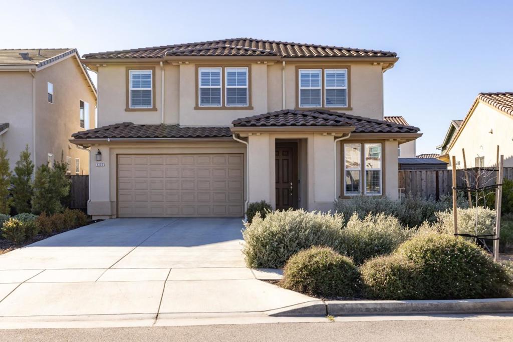Brilliant sunlight reigns supreme inside this beautifully updated two-story sanctuary within the highly sought-after community of Monte Bella in Salinas. Each premium finish has a Mediterranean flair subtly evocative of golden Tuscan vineyards and Old-World estates. Feel smooth LVP flooring underfoot as the layout beckons you from the covered entry to the open concept kitchen and living room, where you will find glistening white quartz countertops, a walk-in pantry, and upgraded cabinets with deluxe hardware. It feels natural to imagine this space filled with the laughter and smiling faces of friends and loved ones, who will move easily, wine glass in hand, from the living area through sliding glass doors into an immaculate backyard. When you find yourself craving some relaxation time, head upstairs to the informal family room: an ideal spot for a cozy sectional, a big-screen TV, or custom bookcases to hold your entire collection of beloved classics. Or, convert it to a fifth bedroom! Crown moulding adds an extra touch of elegance to each room. Other features include solar, a rain-sensing sprinkler system, electric car charging stations, a tankless water heater, and more! Plus, there is no HOA! Take control of your destiny, and secure this home built to support your happiness.