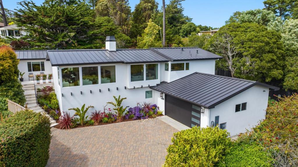 HAVEN by THE SEA! Tucked away in a peaceful Carmel neighborhood, this 3-bedroom, 3-bathroom home offers 2,681 square feet of spacious, light-filled living w/ ocean peaks. Exquisite full custom remodel boasts a flowing floor plan & generous indoor-outdoor connectivity, HAVEN by THE SEA is designed for both comfortable daily living & effortless entertaining. The heart of the home features an inviting living area w/ high ceilings, a cozy fireplace & large windows that frame the scenic surroundings. The open-concept kitchen is well-equipped w/ SubZero and high-end appliances. Enjoy direct access to dining & outdoor spaces. Step outside to the expansive backyard...a private oasis ready for al fresco gatherings, summer BBQ's, or peaceful relaxation. Whether you're entertaining a crowd or enjoying a quiet moment, this yard is made for making memories. Large custom bedrooms including a serene primary suite w/ its own bath and custom built-in closet space. Additional highlights include a dedicated laundry area & a two-car garage. Just minutes from downtown Carmel, world-renowned Pebble Beach golf courses & stunning beaches, this home offers the perfect blend of tranquility, space & convenience. Don't miss your chance to own this entertainers' dream in the heart of the Monterey Peninsula.
