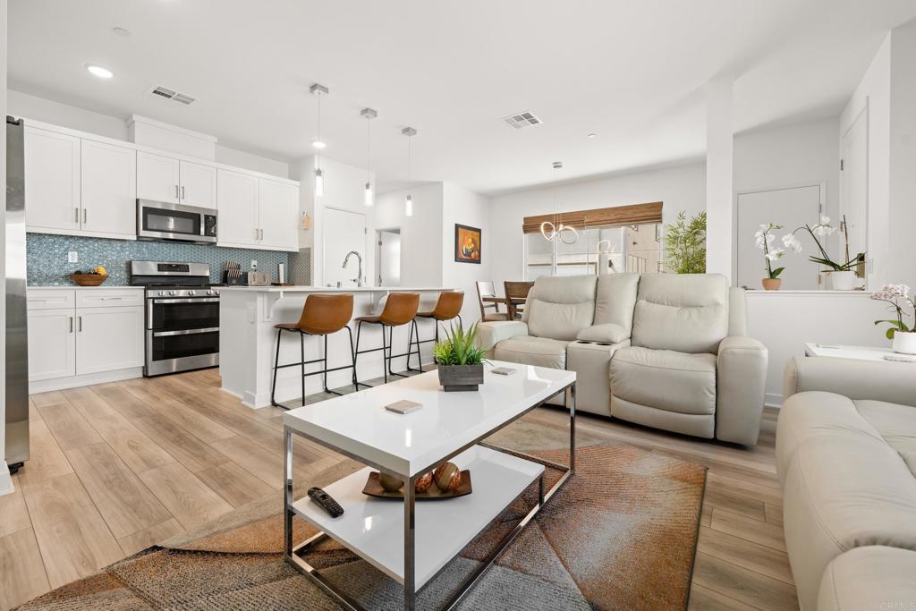 Welcome to your modern dream home in the vibrant Citro Community! This upgraded Meyer Plan 4 features 3 spacious bedrooms, 2.5 baths, a flexible loft space, and a 2-car attached garage—all wrapped in 1,480 sq ft of bright, open living. Situated on a private corner lot with PAID solar, this home is energy-smart and move-in ready! The layout is perfect for hosting friends or unwinding in style. Enjoy resort-style amenities including a sparkling community pool, scenic walking trails, and a beautiful park just steps from your door. With easy access to the 15 and 76, you're never far from the action. Life at Citro is calling—don’t miss it!