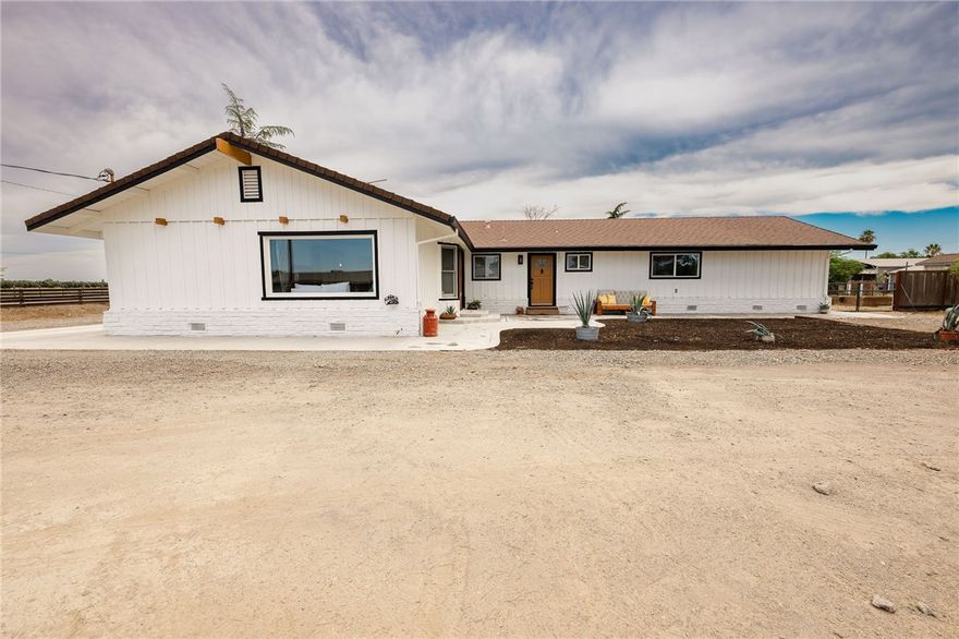 Welcome to this exceptional 4-bedroom, 4-bathroom, 2,460 sq ft home perfectly set up for multi generational living and on a full 1-acre lot located on Orland’s desirable east side—just 20 minutes from Chico. Designed with comfort, versatility, and efficiency in mind, this property features  Owned Solar and three primary suites, including a thoughtfully designed mother-in-law setup—ideal for multi-generational living or private guest quarters.  The beautifully updated main primary suite is a true retreat, showcasing a spa-inspired bathroom and an impressively large walk-in closet. Enjoy year-round comfort HVAC, dual-pane vinyl windows, laminate flooring, fresh interior and exterior paint, and many updated doors and fixtures throughout.  Step outside to stamped concrete patios in the front and back—perfect for entertaining or relaxing—while taking in the views of the expansive fenced backyard. A circle driveway, oversized 2-car garage, and RV hookups and parking offer ample space for all your vehicles and guests.  Love to garden or keep chickens? You’re all set with raised garden beds and a chicken coop already in place. The mother-in-law suite is currently configured with a large laundry room/walk-in pantry, but includes additional hookups in the garage—easily allowing conversion back to a full kitchenette.  This one truly checks all the boxes for space, functionality, and flexibility. Don’t miss the chance to make this unique and well-appointed property yours!   Property will have access to Orland City Water when hookup project is complete. Buyer to verify information with the City Sq ft, lot size and yr built taken from county records buyer to investigate this and all information to their satisfaction.