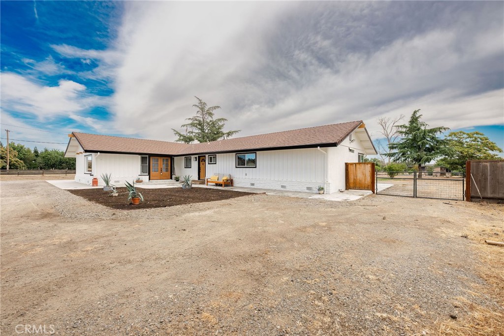 Spacious, Updated, and Ready to Be Your New Home! Welcome to this exceptional 4-bedroom, 4-bathroom, 2,460 sq ft home on a full 1-acre lot located on Orland’s desirable east side—just 20 minutes from Chico. Designed with comfort, versatility, and efficiency in mind, this property features Owned Solar and three primary suites, including a thoughtfully designed mother-in-law setup—ideal for multi-generational living or private guest quarters. The beautifully updated main primary suite is a true retreat, showcasing a spa-inspired bathroom and an impressively large walk-in closet. Enjoy year-round comfort with newer HVAC, dual-pane vinyl windows, laminate flooring, fresh interior and exterior paint, and many updated doors and fixtures throughout. Step outside to stamped concrete patios in the front and back—perfect for entertaining or relaxing—while taking in the views of the expansive fenced backyard. A circle driveway, oversized 2-car garage, and RV hookups and parking offer ample space for all your vehicles and guests. Love to garden or keep chickens? You’re all set with raised garden beds and a chicken coop already in place. The mother-in-law suite is currently configured with a large laundry room/walk-in pantry, but includes additional hookups in the garage—easily allowing conversion back to a full kitchenette. This one truly checks all the boxes for space, functionality, and flexibility. Don’t miss the chance to make this unique and well-appointed property yours! Property will have access to Orland City Water when hookup project is complete. Buyer to verify information with the City Sq ft, lot size and yr built taken from county records buyer to investigate this and all information to their satisfaction.