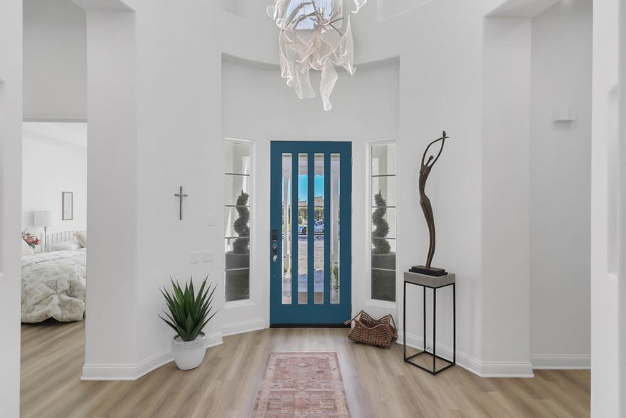 Arroyo and green belt views plus panoramic mountain views on the left across two fairways and a lake. Outdoor living at its finest with a spectacular infinity pool plus adjacent wading pools  with fountains, two stacked rock spills - one from the spa; the other from the firepit. And there's an outdoor kitchen and a sprawling sundeck.The courtyard entry leads you into a soaring 18', skylit rotunda foyer that opens up to BIG  --  a big 43' Great Room, a big 17' Office/Den, a big 18' Family Room; a big 35' Master Suite --  over 4400 sf. of spacious luxury. Guests?...a courtyard casita plus two guest rooms with their own sitting room 9or family room). The Great Room with its bow-window dining room captures the view and is perfect for entertaining. The feature list is endless - dramatic 12' soffited ceilings, 8' doors, gourmet kitchen, Jacuzzi tub and separate shower in master bath, recirculating hot water, switch-start fireplace, etc.