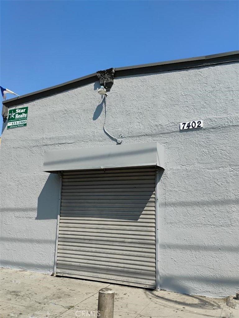 Large commercial building in front (1000 SF) and a single family residence (639 SF) in rear.