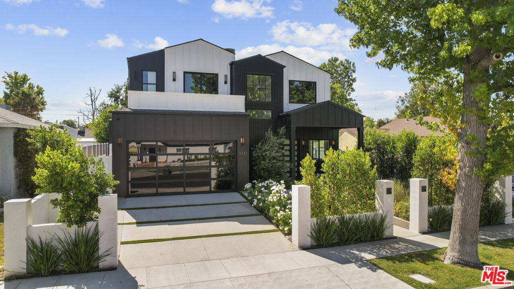 Welcome to your modern Encino retreat! Nestled in a quiet, sought-after neighborhood, this exceptional smart home blends sleek contemporary design with top-of-the-line finishes. Spanning approximately 3,400 sq. ft., the residence offers open, light-filled living spaces enhanced by soaring ceilings, expansive glass doors, and elegant engineered wood floors. Control the integrated speakers, sound system, cameras, and lighting effortlessly from your smartphone. The main level showcases a gourmet chef's kitchen with marble countertops, an oversized island, and premium appliances, perfect for entertaining. A 2-bedroom, 2-bath ADU with a private entrance provides endless possibilities for guests, a home office, or rental income.The luxurious primary suite features a spa-inspired bath with a soaking tub, walk-in shower, and a spacious closet, along with an oversized balcony for tranquil mornings. Outdoor living shines with a lush, landscaped backyard, built-in BBQ, and grassy play area.All just moments from Ventura Blvd.'s premier dining, shopping, and easy freeway access.This remarkable property is truly one-of-a-kind.