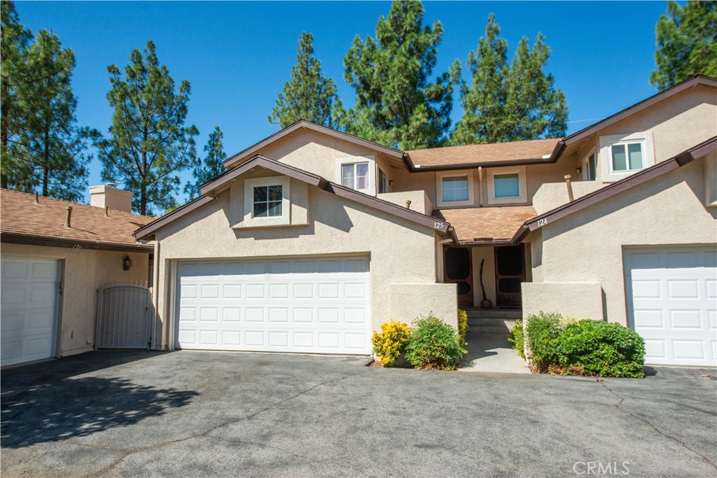 Welcome to 28415 Seco Canyon Road #125! This spacious 2 bedroom, 2.5 bath townhome is move-in ready and full of modern touches in the desirable Mountain View Courtyard community. Enjoy soaring vaulted ceilings, a cozy fireplace, and all-new flooring with fresh paint throughout. The open floor plan creates a bright and inviting space, perfect for entertaining or relaxing at home. Upstairs, you’ll find two generously sized bedrooms, each with its own bathroom for comfort and privacy. Step outside to your private patio, ideal for morning coffee or evening gatherings. Community amenities include a sparkling pool, scenic park, and family-friendly playground—everything you need right outside your door. This home truly has it all—style, comfort, and a welcoming neighborhood!
