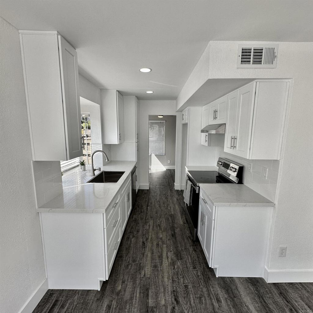 Welcome home to the rarely available 1222 sqft - 3 bedroom and 2.5 bath -  two story condominium. Bottom level features living room, kitchen, laundry room with W/D hookups, under-stair storage, 1/2 bathroom, dining area and spacious patio area with water heater storage closet. Upstairs features 3 bedrooms, 2 full bathrooms, and hallway linen closet. All new vinyl/carpet/baseboard, new kitchen cabinets/quartz countertop, new ceiling fans, new mirrored closet doors. Fresh neutral paint. Community pool. 2 reserved parking spaces. HOA includes trash.