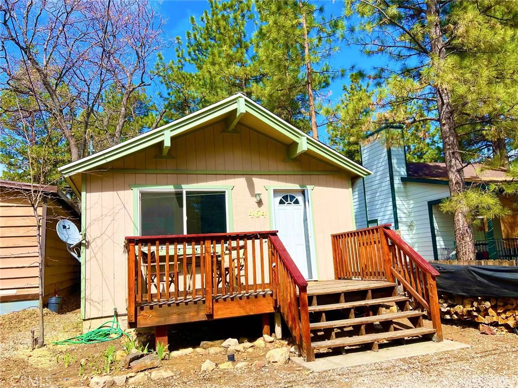 Welcome to this gorgeous cabin in the woods! You will enjoy connecting with nature, hearing the bird chipping, and star gazing at night! This cute and well maintained cabin offers 2 bedrooms and 1 bathroom, large walk-in closet in both bedrooms. The house recently underwent major upgrades, including the brand new laminated flooring throughout the house, brand new roof with insulated ceiling which helps keep the house warm in the winter time, laundry on the premise, huge shed in the enclosed backyard. High vaulted ceiling, large front and backyard, abundant of natural light, full functional kitchen. In the winter time, you can surrounded by the the fire place to enjoy your favorite drink and create beautiful memories here. Close to the ski, restaurants and local amenities. A cozy house that you can enjoy the nature, fresh, relax, and recharge yourself from the busy city. Big bear is well know outdoor entertaiment,ski, car racing, kayaking, boating on the lake, fishing, and many other fun activities year around. 3 Million annual visitors going up to the mountain for weekended get away. Additionally, this can be your second home or rental for generating extra income. The property has no HOA, low tax rate. Invest in this type of property is very good Hurry, this won't last!
