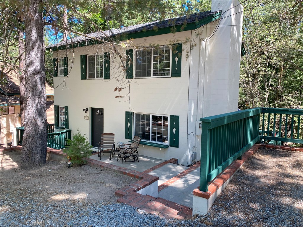 Experience mountain living in this beautiful two-bedroom, two-bath home with bedrooms upstairs and one bathroom on each level. The updated kitchen flows seamlessly into bright, open living spaces, perfect for everyday living and entertaining. Enjoy a spacious wrap-around deck ideal for relaxing or hosting, surrounded by peaceful forest views on a large, private property in a quiet neighborhood. The home includes in-home laundry room and two dedicated parking spots. Just minutes from the Village, Rim of the World High School, and local hiking trails.