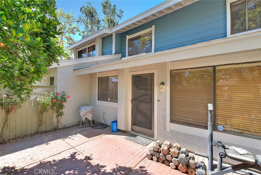 This two-story condo offers 2 bedrooms, 1.5 bathrooms, and a 2-car attached garage with direct access. The spacious living room features a cozy fireplace, and the kitchen overlooks the front patio, perfect for relaxing. Large primary bedroom with high ceilings and a bathroom with double sinks. Both bedrooms come with ceiling fans for added comfort .Laminate wood flooring runs through the living room, kitchen, dining area, and stairs. Located close to shopping, restaurants, schools, and with easy freeway access, this home is well-kept, and move-in ready!