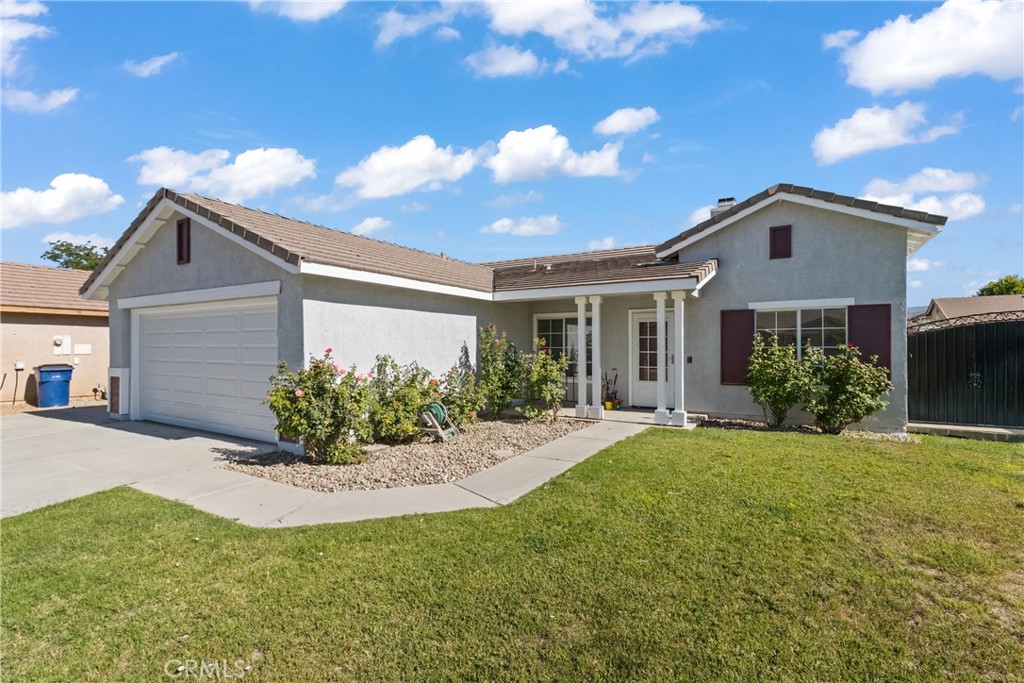 BEYOND ESTATES PRESENTS: MOVE-IN READY SINGLE-STORY HOME WITH SOLAR AND SPACIOUS BACKYARD Welcome to this charming and energy-efficient single-story home, located in a peaceful neighborhood and ready for its next chapter. Step inside to find a light-filled interior with updated flooring, fresh paint, and a functional open layout. The living room features a cozy fireplace and ceiling fan, creating a comfortable space to relax. The kitchen is equipped with stainless steel appliances, granite countertops, and oak cabinets, offering both style and functionality for everyday use. Outside, enjoy a large backyard with a clean grassy area, perfect for entertaining, pets, or future landscaping. The home also includes leased solar panels, a two-car garage, and a wide driveway with potential RV access. Centrally located near parks, schools, and shopping, this well-maintained home is a standout in the area. Don't wait—schedule your private showing today and explore all this move-in ready home has to offer.