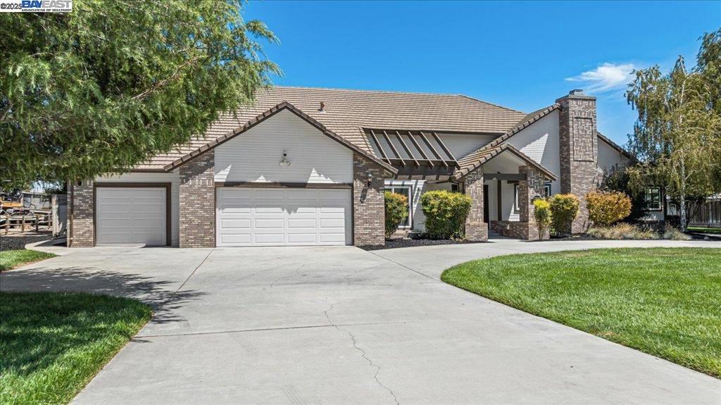 Welcome to 27000 Hillview Drive, Tracy – Where Country Elegance Meets Equestrian Living! Step into Bojoli Estates, one of Tracy’s most desirable communities, and discover this exceptional single-story custom estate offering over 3,400 sq. ft. of beautifully designed living space on a spacious 1.34-acre lot. From the moment you arrive, the circular driveway, brick-accented exterior, and grand formal entry set the tone for the quality and charm found throughout the home. Inside, you’ll find 4 large bedrooms and 3 full bathrooms, including a Jack and Jill suite, formal living and dining rooms, a spacious family room with fireplace, and a generous kitchen with a breakfast nook—perfect for entertaining or quiet mornings at home. Fresh interior/exterior paint and professionally landscaped front and rear yards enhance the property’s curb appeal and outdoor living potential. For horse lovers, this property is fully equipped with a newer 7’ vinyl privacy fence, a 30x10 barn with two 10x24 paddocks, and a 120x72 riding arena. Plus, there’s ample RV parking and storage—ideal for your trailers, boats, or recreational vehicles.