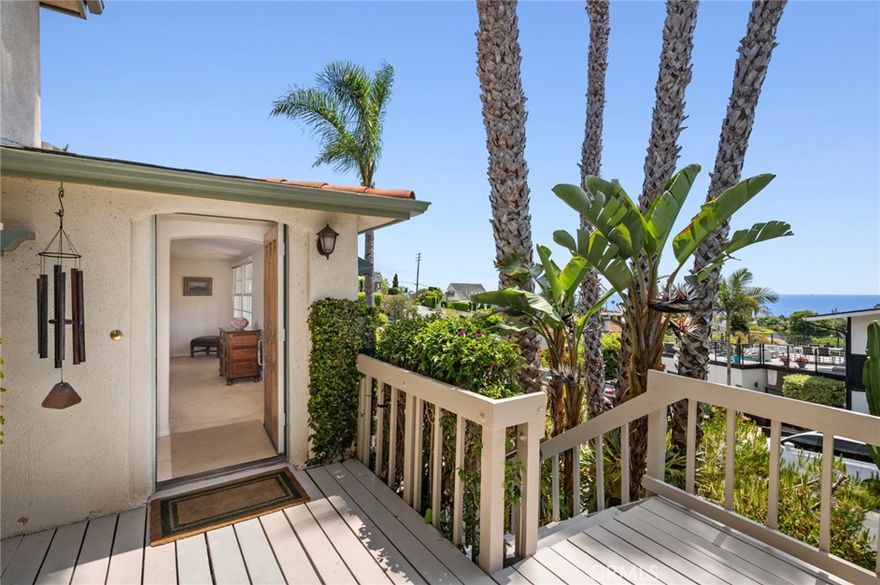 Experience refined coastal living in this ocean-view residence, ideally located in one of Laguna Beach’s most desirable neighborhoods. Just a short stroll from acclaimed restaurants, art galleries, world-renowned beaches, and the vibrant heart of Laguna Village, this timeless home offers the ultimate blend of charm, lifestyle, and convenience. The property beautifully combines classic architectural character with modern comforts. Offering four bedrooms and three-and-a-half bathrooms, the flexible floor plan includes a separate entrance to the lower-level rooms, ideal for guests, extended family, or a creative studio space. A main-level bedroom allows for single-level living and connects to an additional room that can serve as a den, media room, or family room, with access to a spacious finished storage area. At the heart of the home, a sunlit family kitchen with ample storage opens to a generous ocean-view deck—perfect for al fresco dining, garden views, and breathtaking sunsets over Catalina Island. A flat grassy yard and mature landscaping create a peaceful, private outdoor retreat. The primary suite is a tranquil sanctuary, featuring sweeping ocean views, natural light throughout, vaulted ceilings, and an oversized skylight that fills the space with sunshine by day and starlight by night. The en-suite bath offers garden views, a soaking tub, and a separate shower for a spa-like experience. The home’s prime location makes it easy to leave the car behind and explore magnificent beaches, scenic parks, and the celebrated restaurants, cafe´s, galleries, and boutiques that make Laguna Beach such a coveted destination. This property promises an unparalleled coastal living experience.