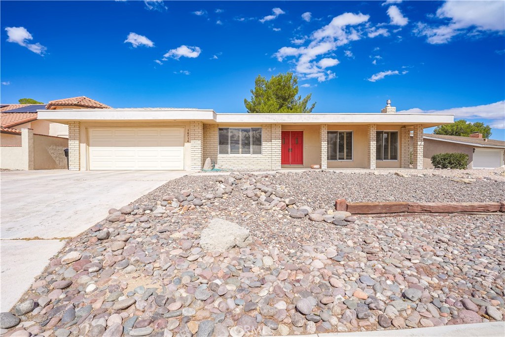 Experience Silver Lakes living in this serene golf course home with comfort, style, and stunning views. Upon entering, you are greeted by the living room featuring upgraded wood-look plank flooring, a stone fireplace, and large windows with shutters that fill the space with natural light. The kitchen offers ample cabinet space and opens to the dining area with a wet bar, ideal for entertaining. Tile flooring runs through the main areas, with carpeted bedrooms for added comfort. The primary bedroom offers sliding doors to the back patio and yard with stunning golf course views, a spacious walk-in closet, and an ensuite with a vanity and tiled shower. The hallway bathroom includes washer and dryer hookups. Step outside to enjoy peaceful mornings or sunset views over the golf course. Don’t miss this opportunity — schedule your showing today!