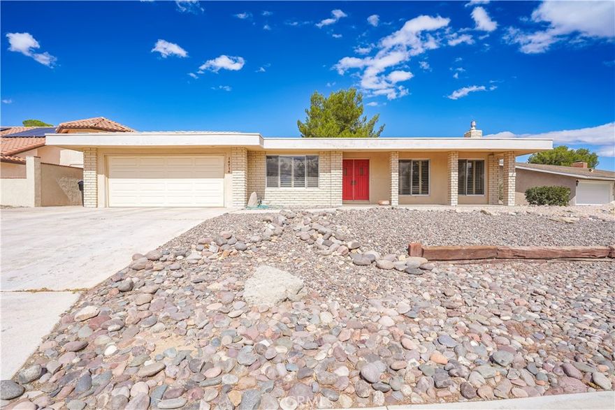 Experience Silver Lakes living in this serene golf course home with comfort, style, and stunning views. Upon entering, you are greeted by the living room featuring upgraded wood-look plank flooring, a stone fireplace, and large windows with shutters that fill the space with natural light. The kitchen offers ample cabinet space and opens to the dining area with a wet bar, ideal for entertaining. Tile flooring runs through the main areas, with carpeted bedrooms for added comfort. The primary bedroom offers sliding doors to the back patio and yard with stunning golf course views, a spacious walk-in closet, and an ensuite with a vanity and tiled shower. The hallway bathroom includes washer and dryer hookups. Step outside to enjoy peaceful mornings or sunset views over the golf course. Don’t miss this opportunity — schedule your showing today!