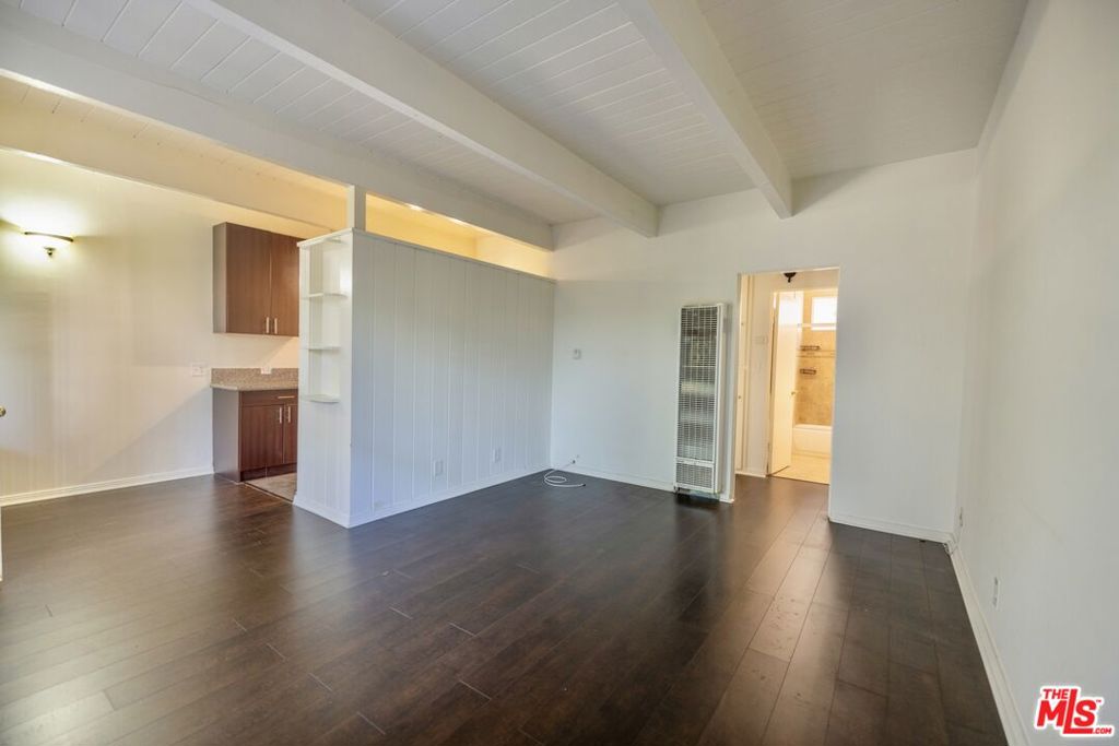 Bright, stylish and perfectly located- this 1-bedroom gem in Beverly Hills offers comfort and charm. Enjoy sunlit rooms with hardwood floors, a spacious layout, and a sleek, updated kitchen. Nestled in a quiet, tree-lined street just south of Wilshire, this classic mid- century building blends tranquility with unbeatable access to Beverly Hills shopping, dining, and culture. Reserved parking, on- site laundry, and Beverly Hills Unified School District complete the package. A rare find in an iconic neighborhood.