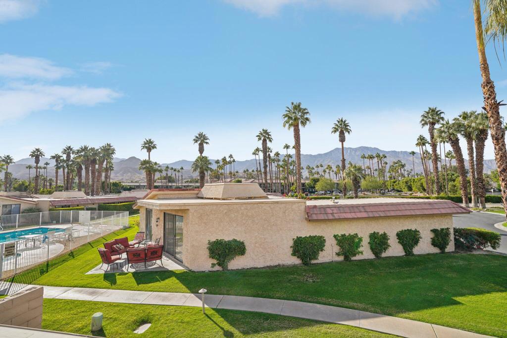 Welcome to your perfect desert retreat in the highly sought-after Cathedral Canyon Country Club!This spacious home combines comfort and sophistication with a bright, open floor plan that's bathed in natural light, creating an inviting and airy ambiance. The kitchen is thoughtfully designed with plenty of counter space and a nearby laundry closet for added convenience.Entertain with ease in the living room, complete with a built-in bar and generous storage. Upstairs, you'll find two expansive primary suites, each featuring its own walk-in closet and private en-suite bath. Wake up to peaceful mountain views from the rear suite or enjoy partial golf course views from the front.Step outside to your own private patio--ideal for relaxing or entertaining--framed by beautiful mountain scenery and just steps from the sparkling community pool. Retractable awnings offer the perfect shade, making this space comfortable year-round.A covered garage provides added protection and ease of access. Nestled in a secure, gated community, Cathedral Canyon Country Club offers resort-style living with amenities like a championship golf course and heated pool. Centrally located, you're just minutes from the best shopping, dining, and attractions the Coachella Valley has to offer.Don't miss your opportunity to own a piece of paradise in this vibrant and welcoming community!