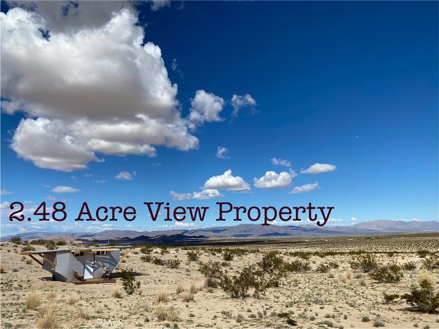 2.48 acres with an exceptional view in all directions. Easy access from Hwy 62. Located within a short drive to the Joshua Tree National Park and all the recreational amenities of this part of the Mojave Desert. The structure on the property is optional with purchase. Zoned Rural Living. This would be a wonderful custom home site. Consider the possibilities with a well and off grid living? The owner will carry with a 40% downpayment of $6,600, a first trust deed and note for $9,900 at 11% interest for a term not to exceed 36 months with a reasonable payment of $324.30 per month. Drive by and check out the view.