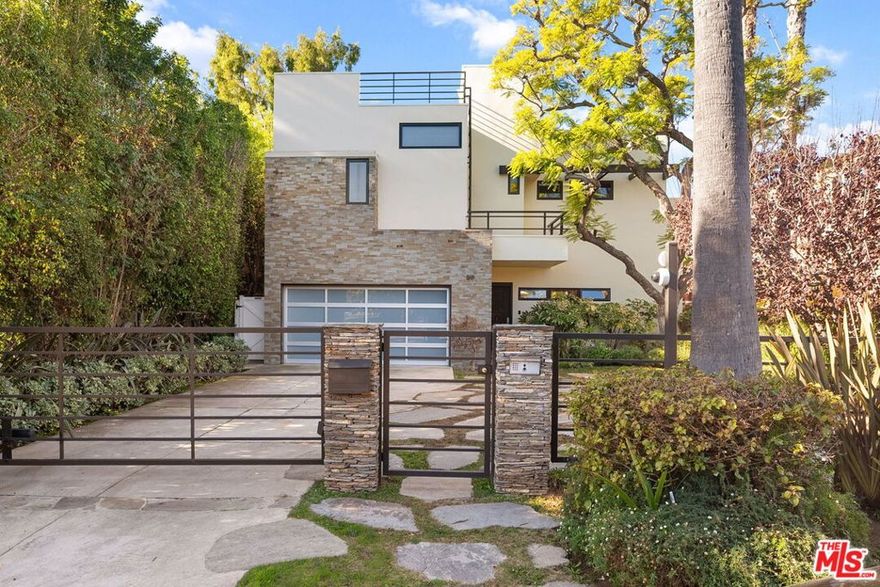 Beautifully designed and fully furnished Michele Saee architectural residence offering 3 bedrooms and 2.5 baths. Set on one of Brentwood's most prestigious streets, this sophisticated and private home is surrounded by lush landscaping and curated outdoor living spaces. Recently remodeled with a refined blend of stone, wood, and glass, the interior features an exquisite primary suite, a gourmet kitchen with Viking appliances and custom cabinetry, a 150-bottle wine fridge, projection screen, and multiple flat-screen TVs. Elegant furnishings carry throughout. The resort-style backyard includes a pool, spa, fire pit, and built-in BBQan exceptional retreat in a premier location.