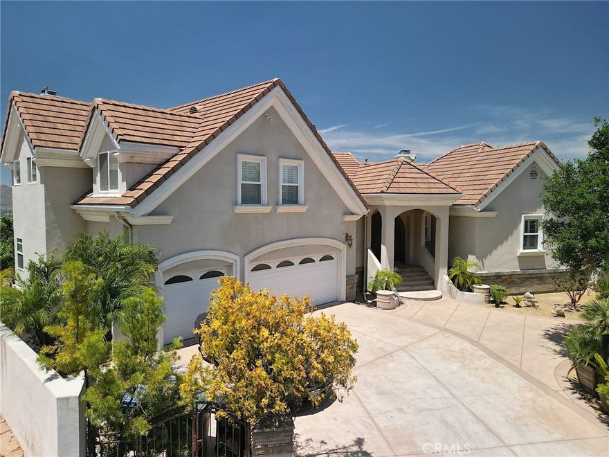 Excellent views of mountain, valley and city lights!!! Experience unrivaled luxury and breathtaking views in this exquisite custom estate. This custom-built home offers 5 separate HVACs, 2 hot water tanks, 3 separate entry points, 2 laundry rooms, 3 Master suites and 2 bedrooms, 5 full bathrooms, a powder room and a huge loft w/LED recessed lights through. A guesthouse above the garage with private and separate entrance, ensures both stunning views and complete privacy for visitors or extended family. Step through the double entry door into a grand foyer to captivating views showcased through the open-concept design of the expansive kitchen, living room, and family room with automated window blinds. Elegant travertine flooring throughout the main living areas, including the entry, living room, dining room, kitchen, and family rooms, and a hardwood floor Master bedroom. The gourmet kitchen is a chef's delight, granite countertops, abundant custom cabinetry, a unique log-accented island with a prep sink, a professional-grade Viking stove w/stainless steel appliances. The expansive living room, complete with a fireplace and stunning views, opens to a private balcony-the perfect spot for morning coffee or evening cocktails. A dining room offers an intimate ambiance with breathtaking panorama. Spacious family room, featuring a fireplace and seamless access to a large patio, provides a mesmerizing backdrop of the city lights, valley views. Main level is a sprawling and luminous master suite, thoughtfully designed to maximize the incredible views and a cozy fireplace. Master bathroom offers dual sink granite vanities, a relaxing spa tub, a separate dual-head shower, a private toilet, and a walk-in closet. Lower level provides two additional master suites, each boasting an en-suite bathroom and a private den with wet bars possible to kitchenette. Along with an additional bed & bath and a convenient laundry room in the hallway, as well as another dedicated laundry room for added convenience. This exceptional estate is energy-efficient central HVAC in each 5 bedrooms. Finished three-car attached garage includes a hot water heater, and the two garage doors are operated by a single remote. Ample on-site parking is available for 5 vehicles or RV Park.