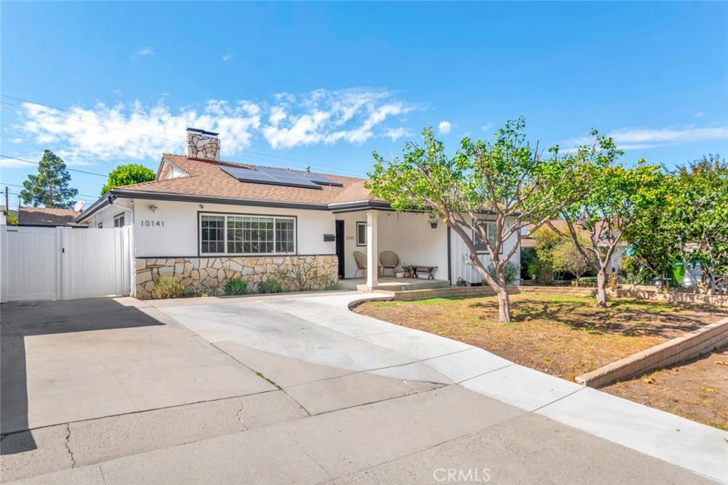 Turn-key and thoughtfully remodeled, this 3 bed / 3 bath home offers 2,133 sq ft of stylish living on a 6,300 sq ft lot in a quiet South Sunland pocket. A formal living room connects seamlessly to the open great hall, kitchen, dining, and living room—ideal for everyday comfort and entertaining. The kitchen features custom cabinetry and a large island with abundant storage. The flat, usable yard is enriched by fruit trees and ADU potential, while the detached garage, equipped with its own air conditioning, opens up possibilities for a studio, fitness space, or creative workshop. With a solar energy system to reduce utility costs, central HVAC, and modern finishes throughout, this home combines move-in ease with lasting value. Minutes to local conveniences, foothill trails, and the 210 freeway, it’s the perfect blend of style, sustainability, and function.