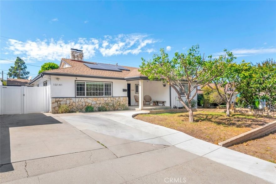 Turn-key and thoughtfully remodeled, this 3 bed / 3 bath home offers 2,133 sq ft of stylish living on a 6,300 sq ft lot in a quiet South Sunland pocket. A formal living room connects seamlessly to the open great hall, kitchen, dining, and living room—ideal for everyday comfort and entertaining. The kitchen features custom cabinetry and a large island with abundant storage. The flat, usable yard is enriched by fruit trees and ADU potential, while the detached garage, equipped with its own air conditioning, opens up possibilities for a studio, fitness space, or creative workshop. With a solar energy system to reduce utility costs, central HVAC, and modern finishes throughout, this home combines move-in ease with lasting value. Minutes to local conveniences, foothill trails, and the 210 freeway, it’s the perfect blend of style, sustainability, and function.