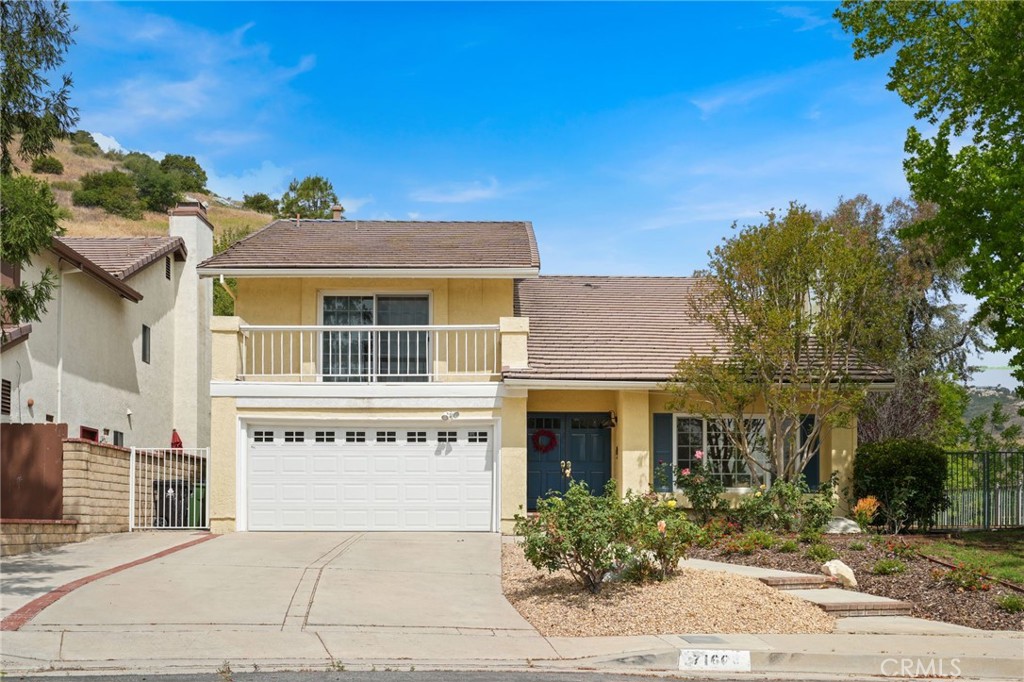 Located in West Hills, west of Valley Circle Boulevard and adjacent to Bell Canyon, this 4-bedroom, 3-bathroom home offers just under 2,500 square feet of living space on a quiet street nestled in the hills within the Las Virgenes School District neighborhood. The two-story layout features a living and dining area with large windows and wood-like flooring. A custom staircase leads upstairs to four carpeted bedrooms and two full bathrooms. The primary suite has a private bathroom and a balcony with community views. Downstairs the family room includes travertine flooring and opens to the backyard through custom French doors. The kitchen features white cabinetry and granite countertops. One powder room, a separate laundry room, and direct access to an attached two-car garage. The backyard offers privacy with no neighbors directly behind or to one side, plus a large side yard. The property is close to mountain trails and minutes from The Calabasas Commons, Westfield Topanga, The Village, and access to the 101 and 118 Freeways.