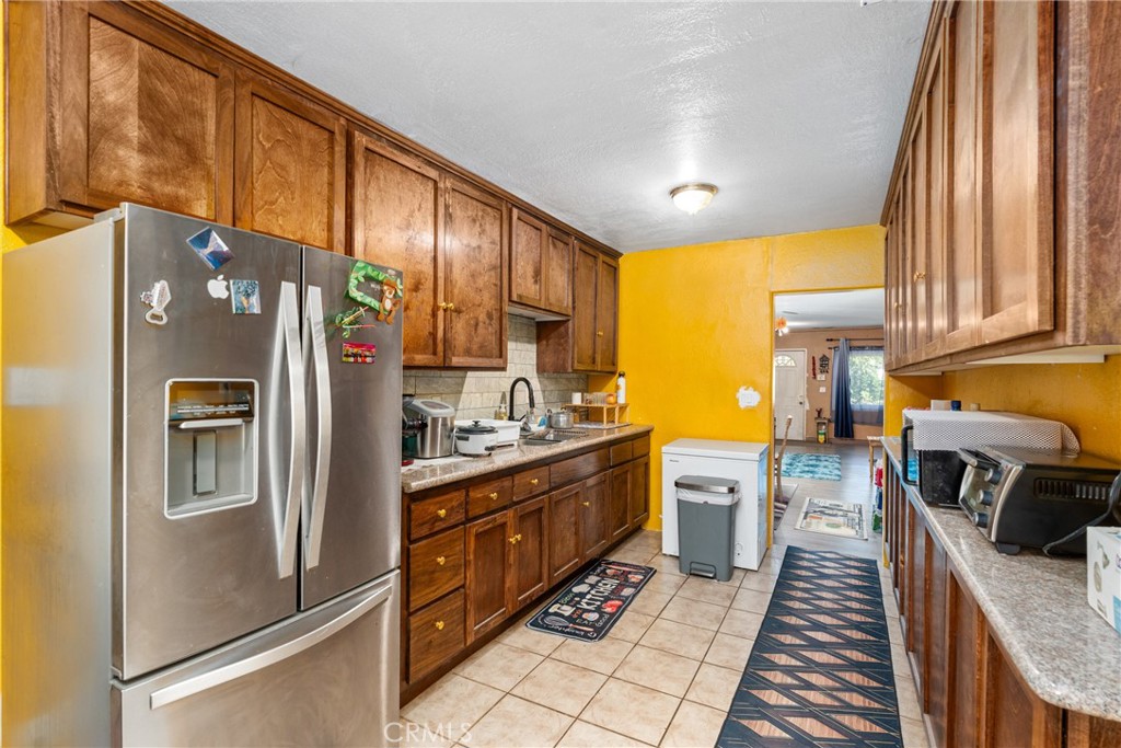 This property features newer interior and exterior paint, newer carpet, newer vinyl and updated light fixtures in most of the home. One bathroom has been updated, along with improvements to the water heater area, partial plumbing, and a section of the roof. The home sits on a spacious lot with plenty of room to enjoy. Perfect for a first-time buyer and conveniently located near Casino Morongo.
