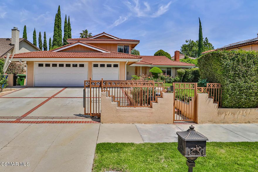 Spacious Porter Ranch pool home with desirable schools. Welcome to this gated home with private yard offering a step-down living room with stone statement fireplace. Remodeled kitchen with custom cabinets, granite counters and bar seating. Formal dining room, marble, tile, and vinyl flooring throughout, no carpet here. Downstairs master suite with remodeled spa like bath with separate tub and shower. Extra converted garage bonus room with bar makes a great family room plus additional room perfect for a home office. Upstairs offers three additional spacious bedrooms with remodeled hall bath. Your private yard offers pool,  spa, covered patio, and large side yard. Home camera security system and lovely landscaping rounds out this special family home.