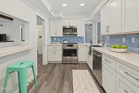 Photo of 7643 Encino Avenue, Northridge, CA 91325 (MLS # P1-28853)