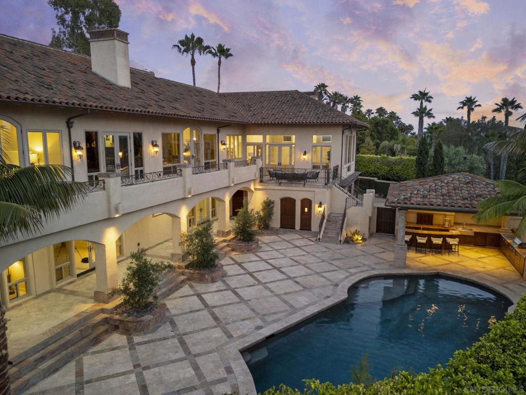 NEW PRICE!!Away from the madding crowd, offering the Best of Ranch & Coast Luxury Living! Behind private motor gates, recently renovated 8,500+ SF estate lives like a true single-level retreat, offering elevated luxury, privacy & cinematic VIEWS stretching past the Del Mar Fairgrounds to the OCEAN & distant mountains. Just minutes from the Del Mar Racetrack, Rancho Valencia Resort & Spa, and Southern California’s iconic beaches. Thoughtfully designed floor plan feat 6+ BRs, 4-CAR garage, private elevator & seamless indoor/outdoor living. Highlights include formal dining with honed stone floors, a mahogany executive office with fireplace, a serene wellness suite with Massage area & Cedar Sauna, and a Great Room with steel-framed floor-to-ceiling windows, wet bar & distressed pecan hickory floors. Gourmet kitchen is appointed with Taj Mahal countertops, custom cabinetry, double ovens, dual dishwashers, pot filler, warming drawer, skylights, and walk-in pantry. Expansive primary suite offers a true spa bath w/ soaking tub, oversized glass shower & dual vanities plus a dramatic two-story custom closet with boutique-style cabinetry and closet island. Smart home systems include Lutron, DoorBird, Nest, Pentair & more. Add'l amenities: 98” 4K media room, 1,180-bottle wine cellar w/ tasting lounge, full gym, and spacious guest suites. Outdoors: tennis court, family BBQ area w/ fireplace, grassy play lawn, private pool & jetted spa, and fully equipped outdoor kitchen w/ ceiling heaters, fridge, BBQ, stove, prep sink & bar. Somewhere over the rainbow wasn’t a dream—it was a blueprint.