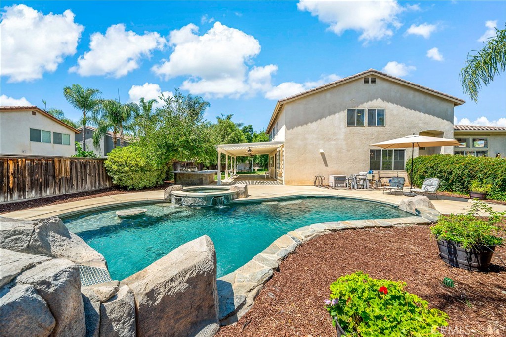 Welcome to your West Murrieta dream pool home! Located on an oversized lot at the end of a cul de sac, this spacious 5-bedroom, 3-bathroom beauty offers nearly 3,300 square feet of comfortable living with room for everyone. Inside, you’ll find brand new carpet throughout, fresh sink fixtures in all bathrooms, and a convenient downstairs bedroom and full bath, perfect for guests or multigenerational living. The large primary suite features a walk-in closet and plenty of room to unwind. Step outside and you’ll see what truly sets this home apart, a massive backyard oasis! Splash into the sparkling pool complete with a waterfall and slide, fire up the built-in grill and relax under the covered patio, or park your RV, boat (or both) with ease thanks to the oversized side yard. Whether you're entertaining or relaxing, this home delivers on space, comfort, and California sunshine. Don't miss your chance to own this slice of SoCal paradise—schedule your showing today!